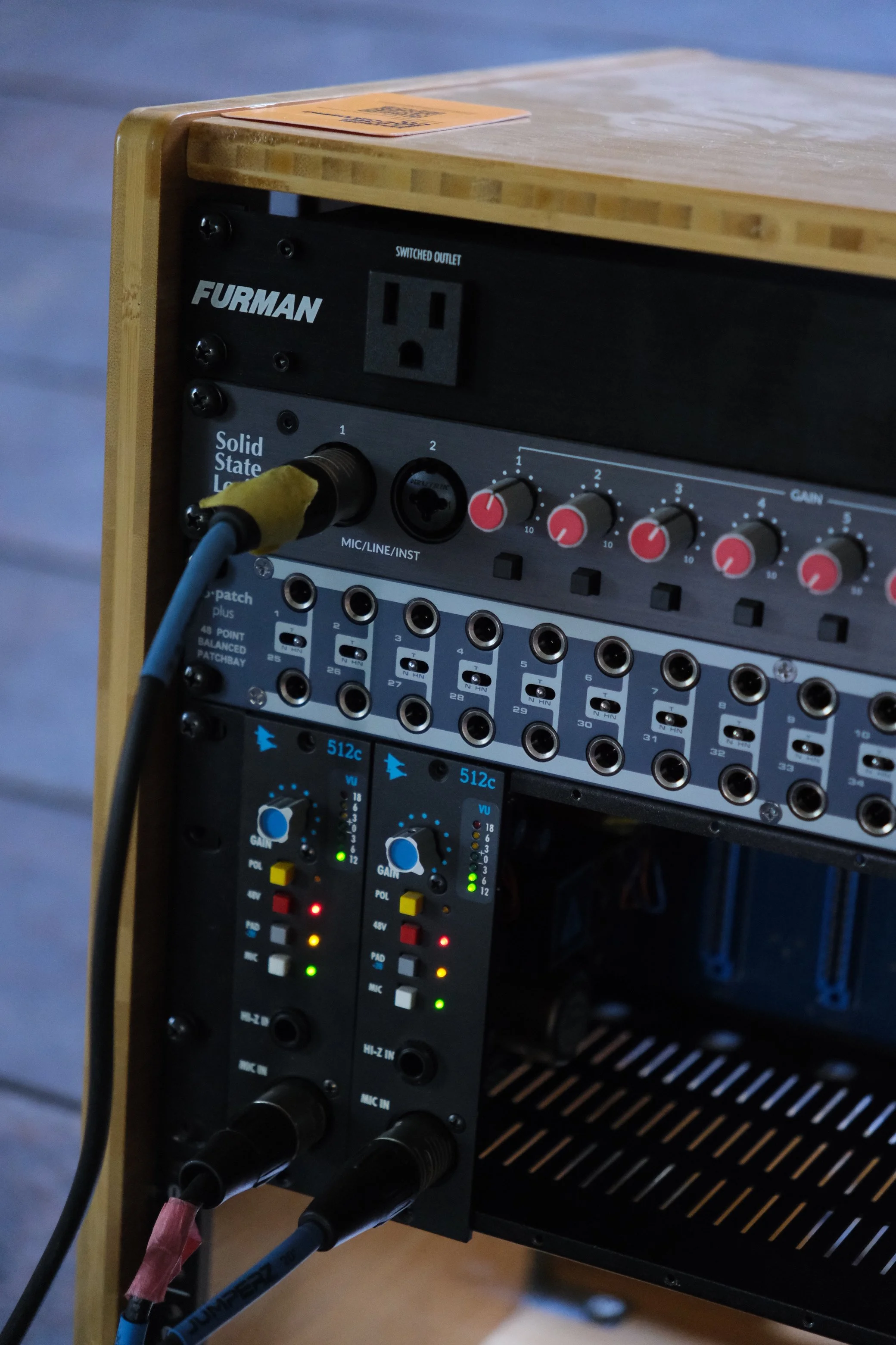 Close-up of the Inner Flame Recording Co. (the best recording studio in New Paltz, NY of the mid-hudson valley) studio rack, loaded with API 512c preamplifiers and a highly-capable SSL 18 audio interface.
