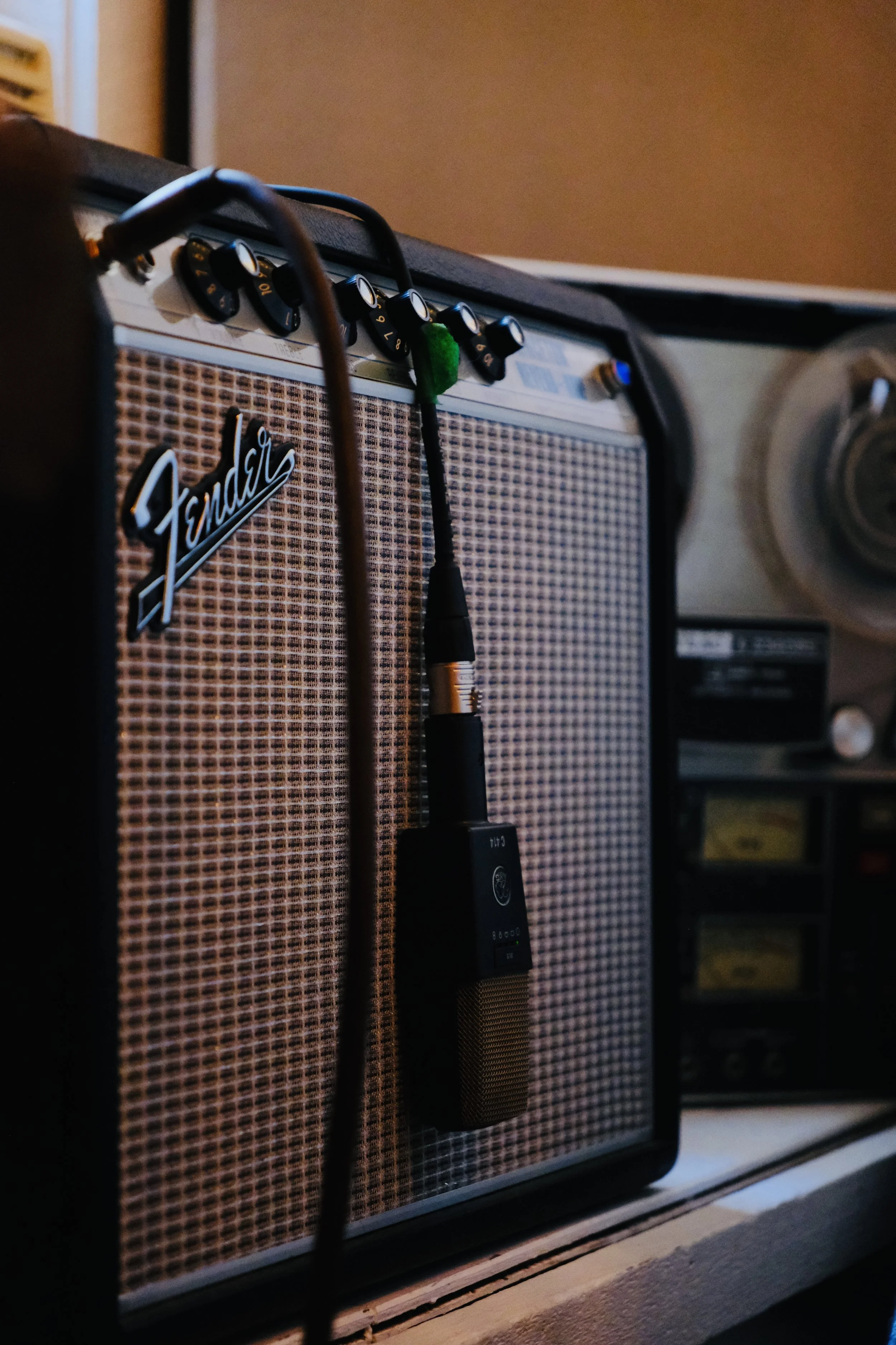 Close-up of a Fender Princeton Reverb guitar amplifier with an AKG C414 XLS microphone at Inner Flame Recording Co., the best recording studio in New Paltz, NY of the mid-hudson valley.
