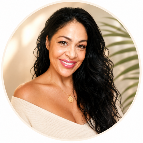 Sandy Brooke Martinez smiling in a cream blouse