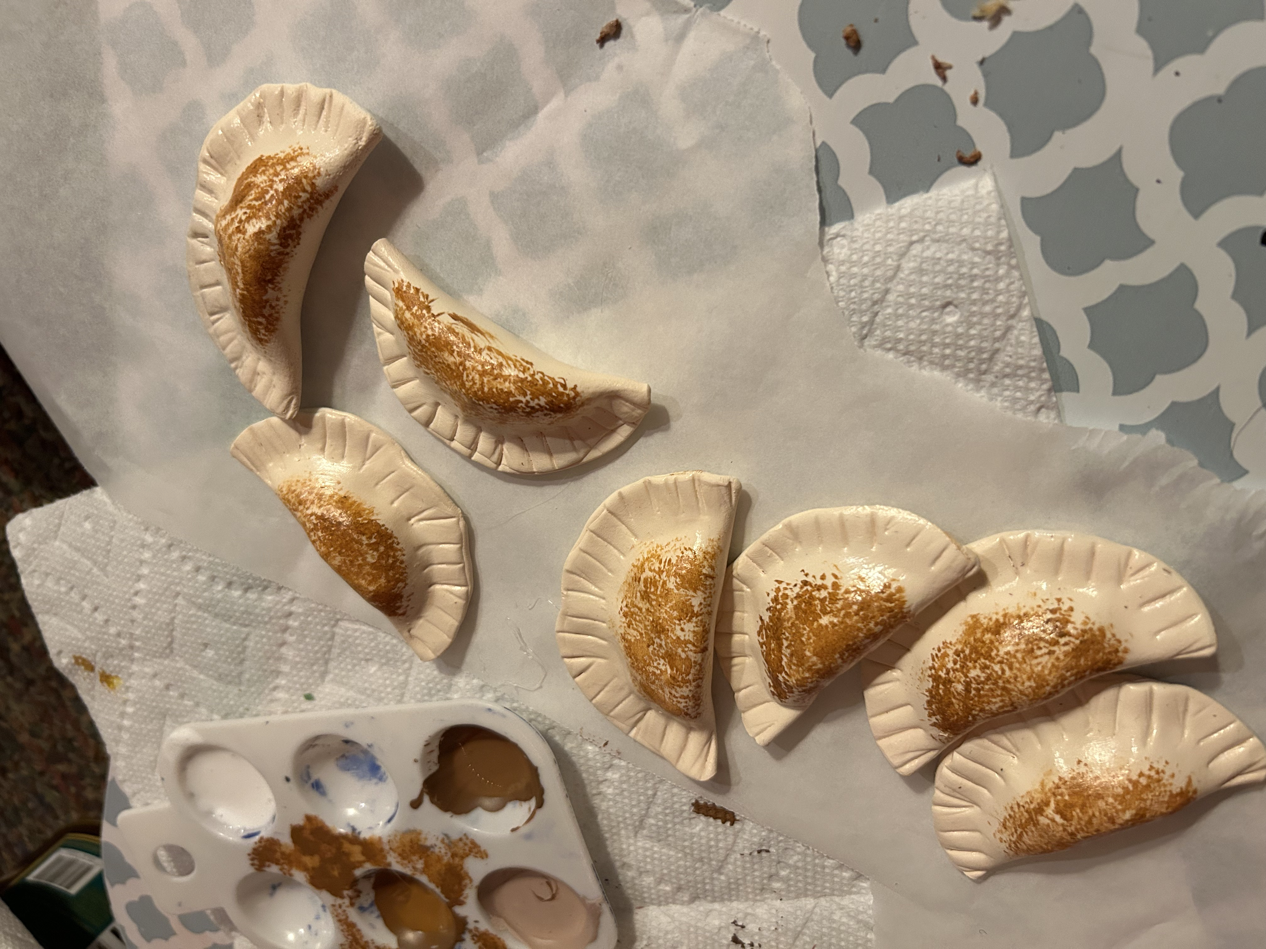 Scenery/Props 2023, Pierogies made with Model Magic, acrylic paint, and glossy Mod Podge.