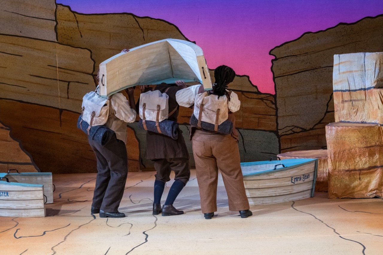 Bedrolls on knapsacks dyed with Rite DyeMore. (actors Kendall Rhue Wilson, Kaitlyn Kaufman, and Delta McCalister) (left to right). photo credit: Lynn Willis