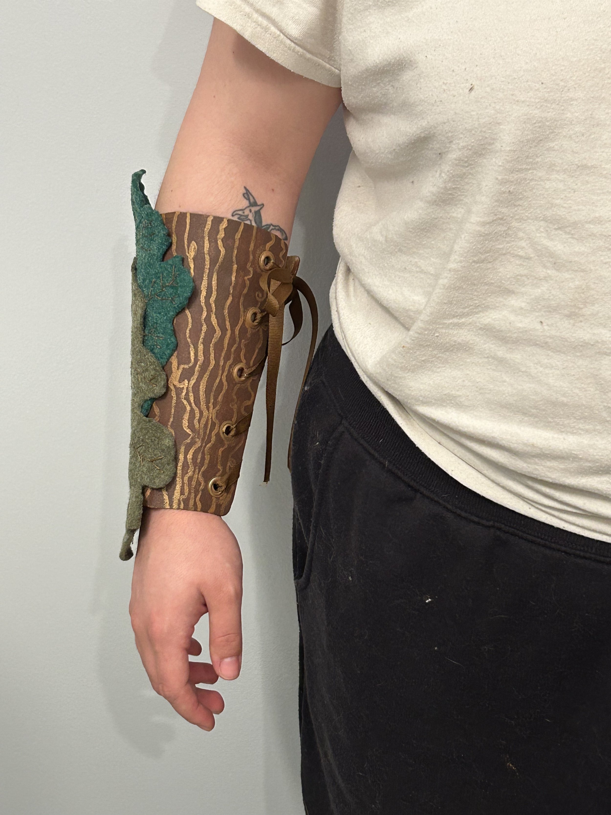 Crafts in Costumes & Props 2024, Thermal plastics project. Final bracer painted with acrylic paint, top coated with Mod Podge.