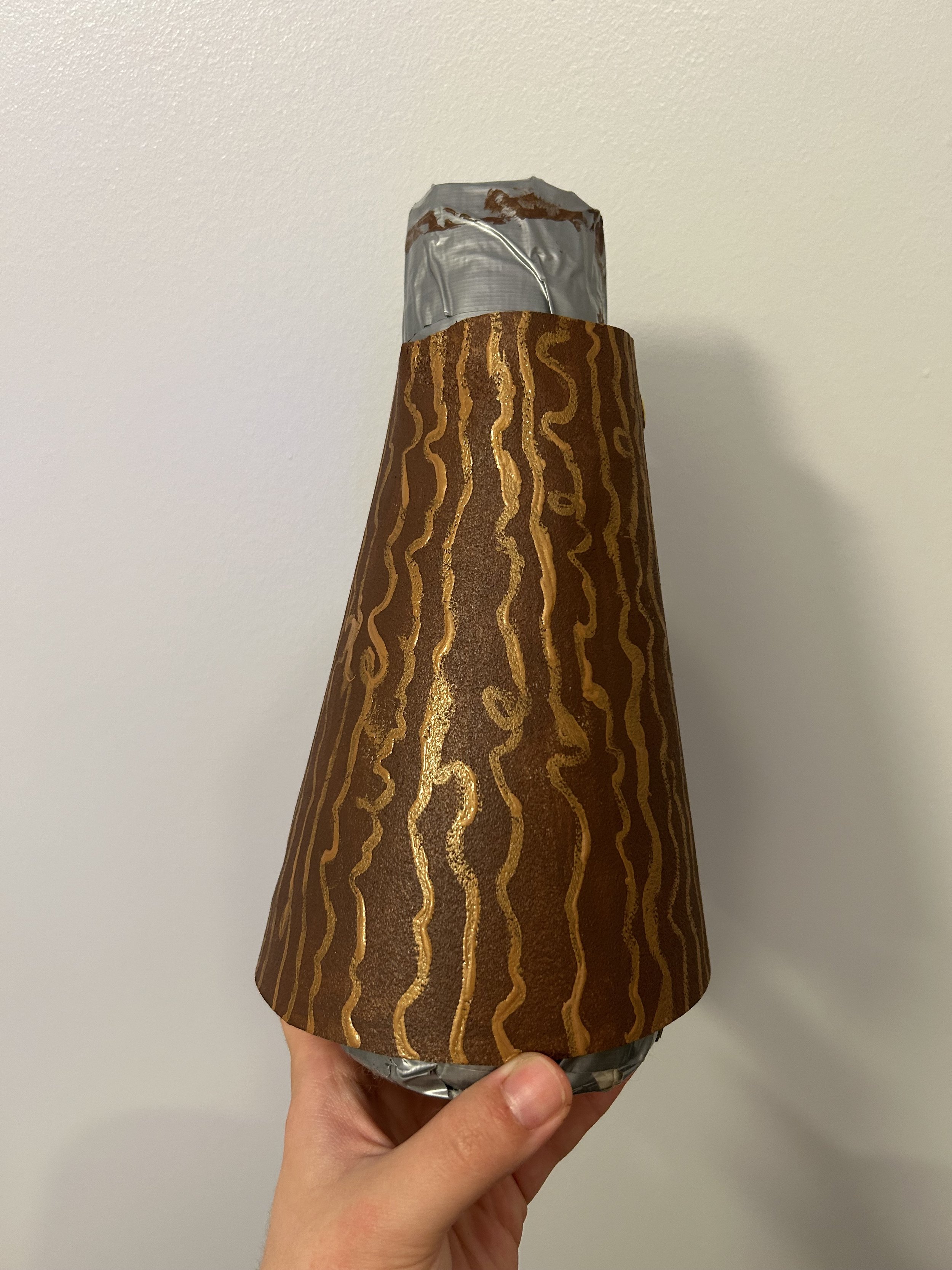 Crafts in Costumes & Props 2024, Thermal plastics project. Bracer painted with acrylic paint, tree bark details done with metallic acrylic paint, and top coated with Mod Podge.
