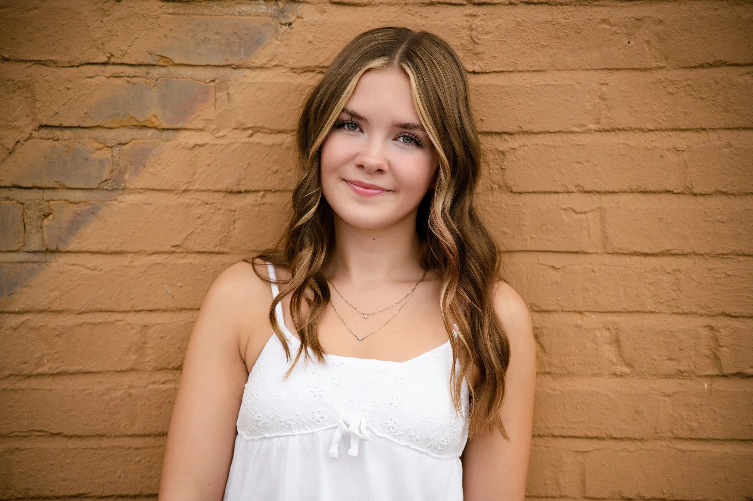 high school girl posing for senior portraits in Janesville, Wisconsin