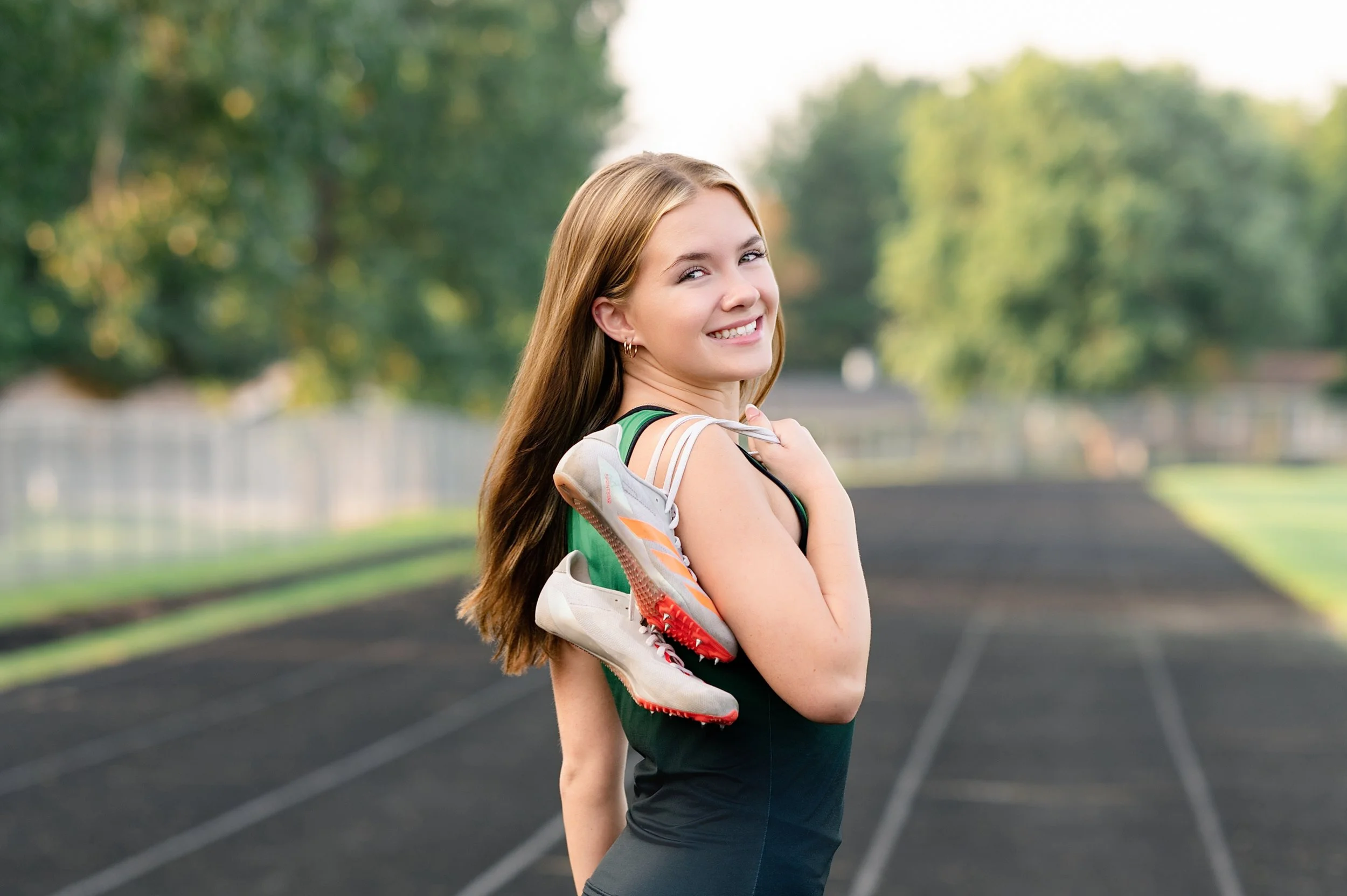 Parker High School tack athlete photographed during senior Portraits in Janesville, Wisconsin