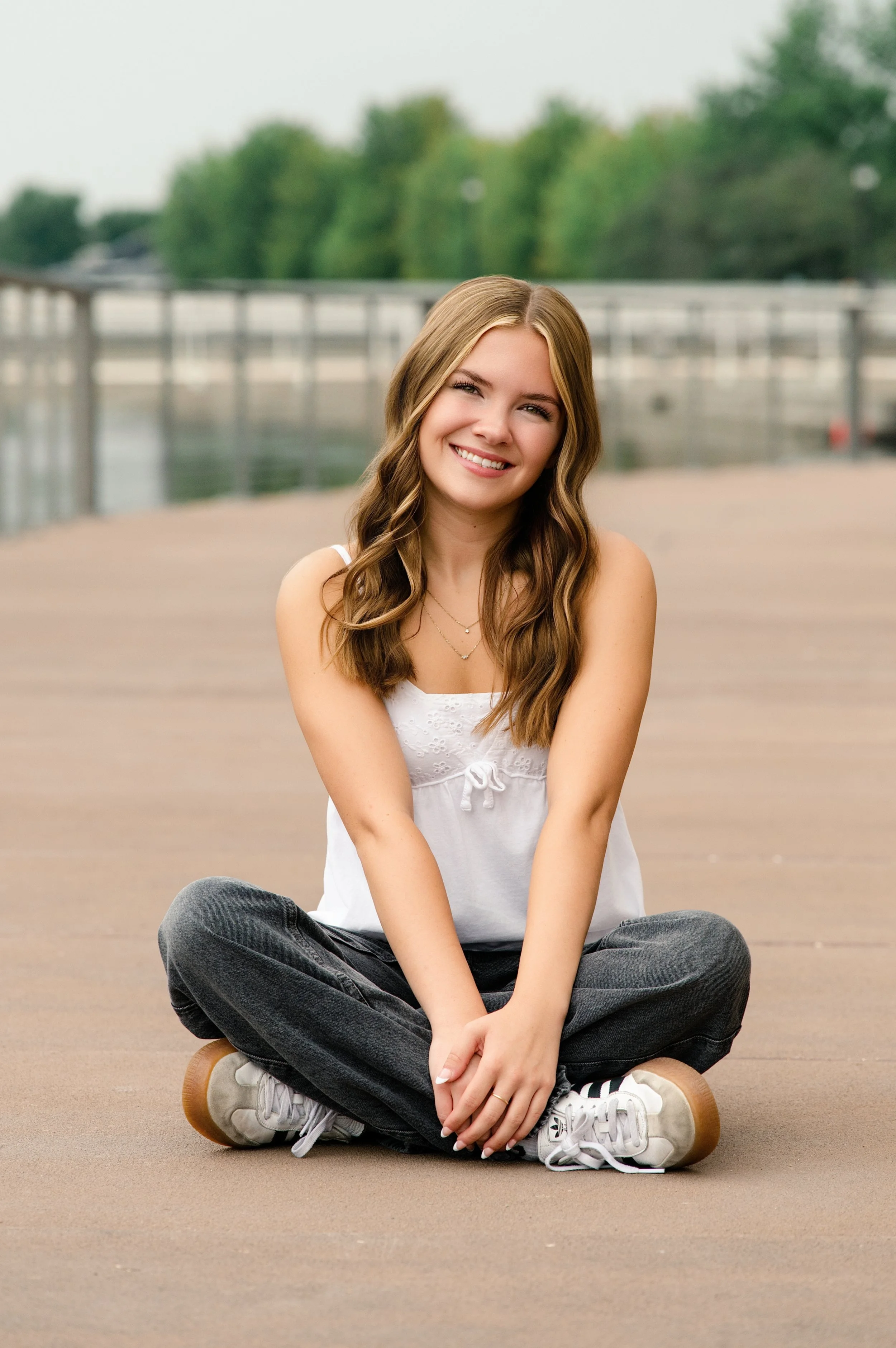 high school senior girl posing outdoors in downtown Janesville, Wisconsin