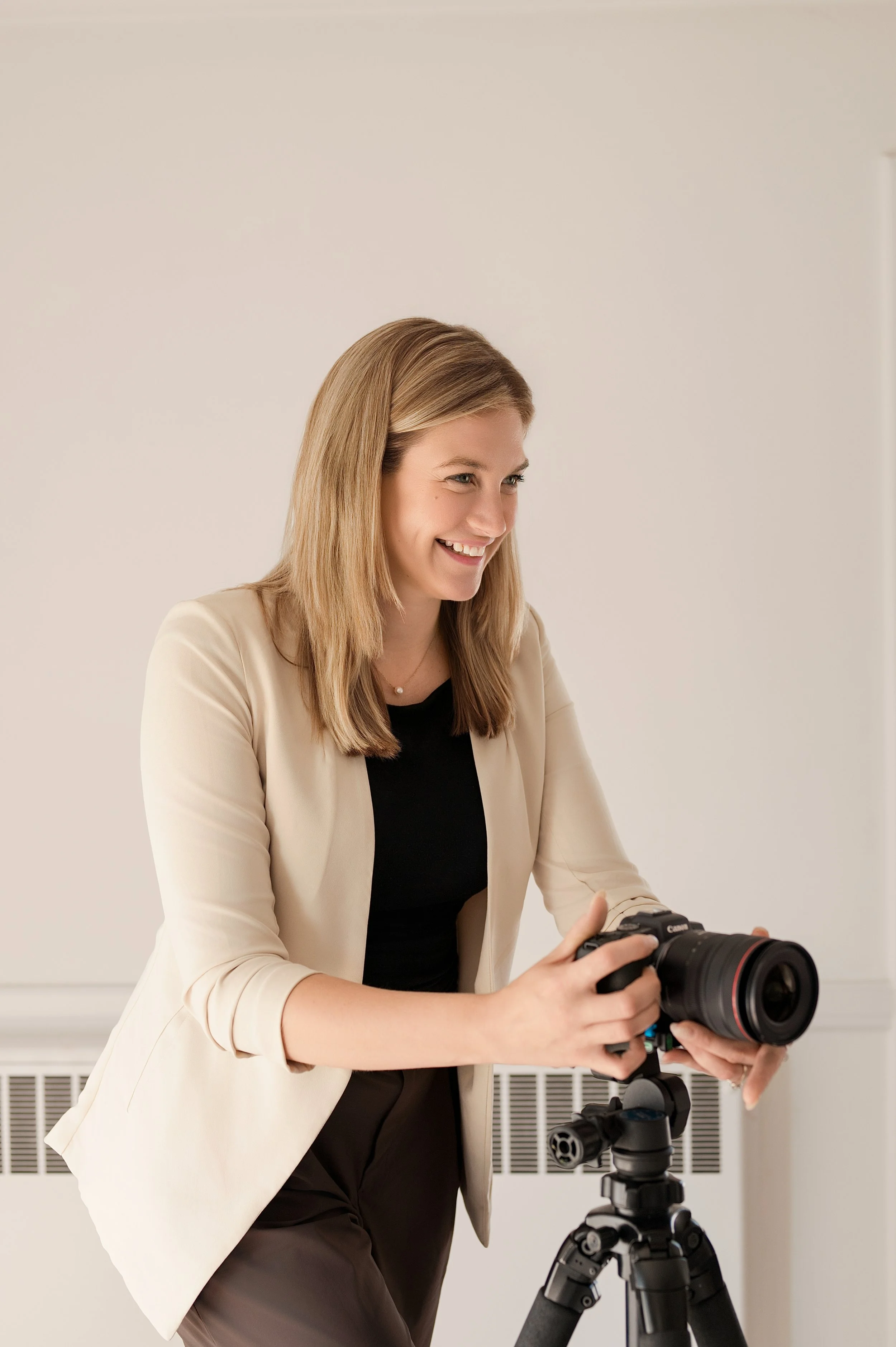 Real estate photographer personal branding session with a female photographer with her Camera 