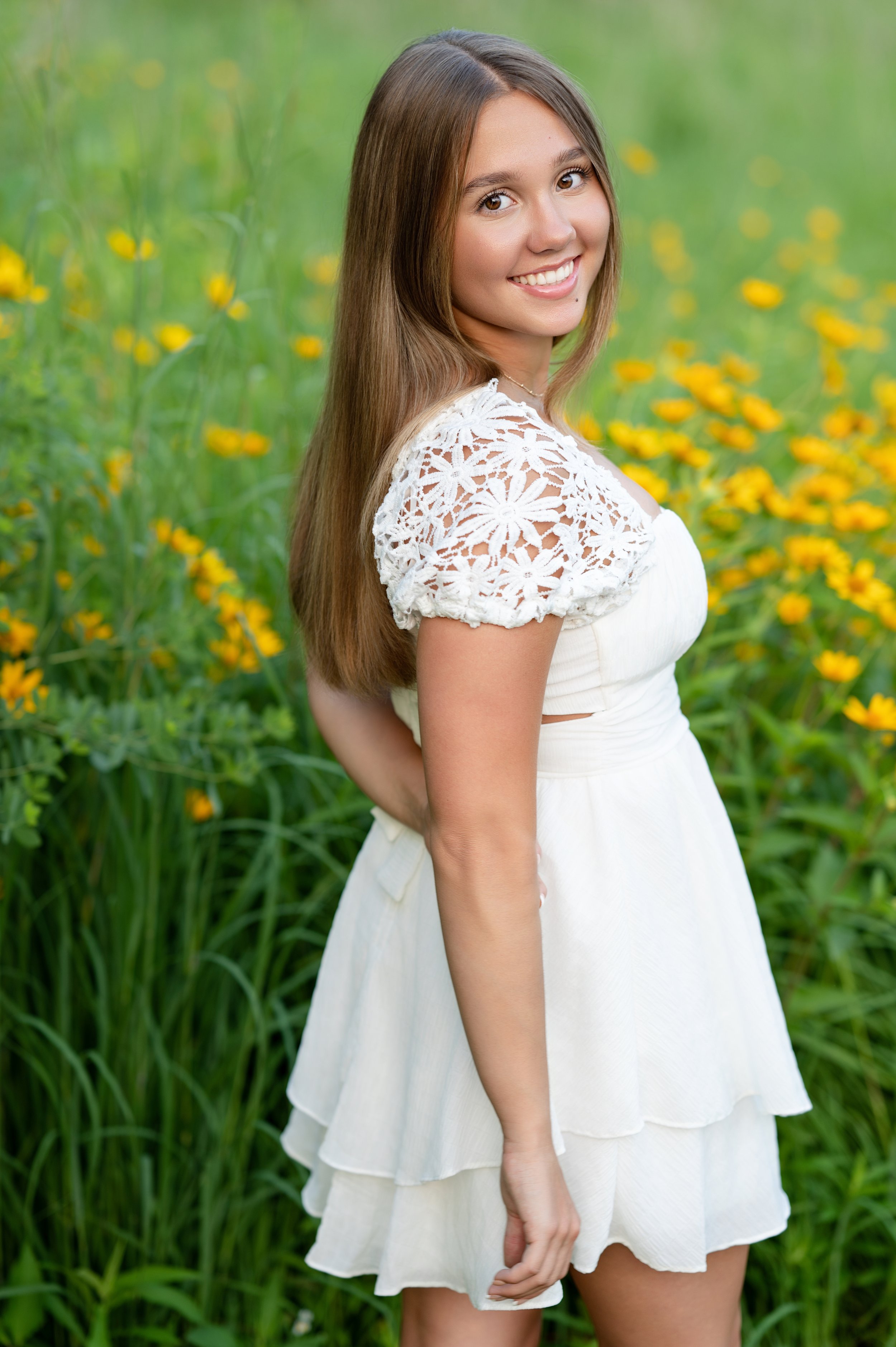 Senior photo session in a meadow in Janesville, WI