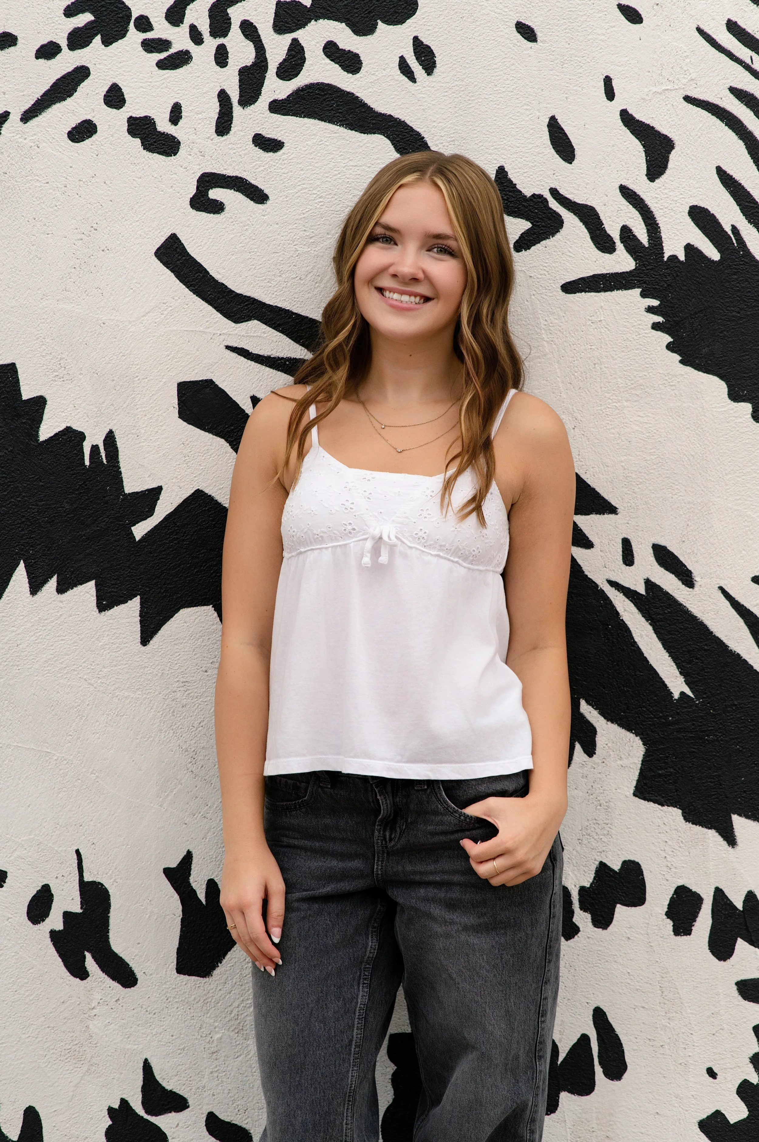 high school girl posing for senior portraits in Janesville, Wisconsin