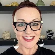 Bridget Baker, a white woman, is smiling at the camera