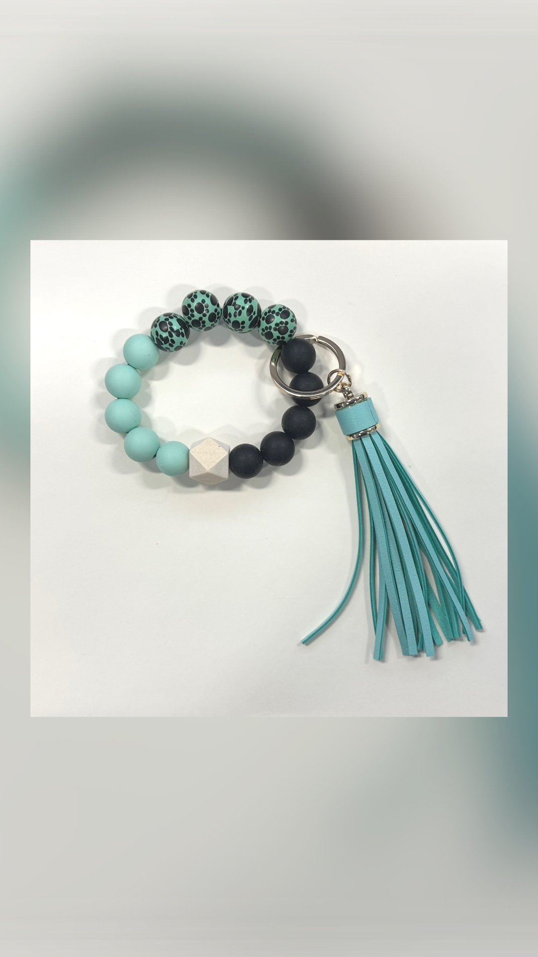 Black+%26+Teal+Paw+Prints.jpg