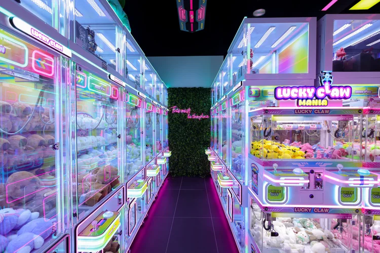 Claw machines and prizes at Lucky Claw Mania