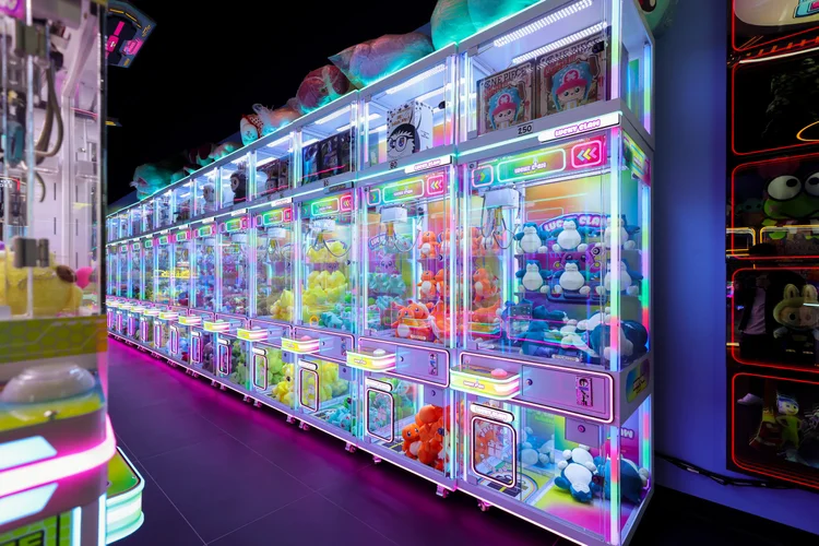 Claw machines and prizes at Lucky Claw Mania