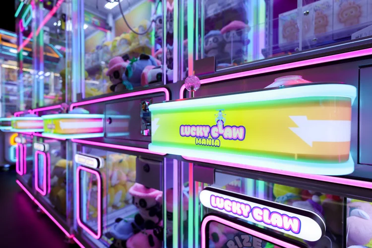 Claw machines and prizes at Lucky Claw Mania