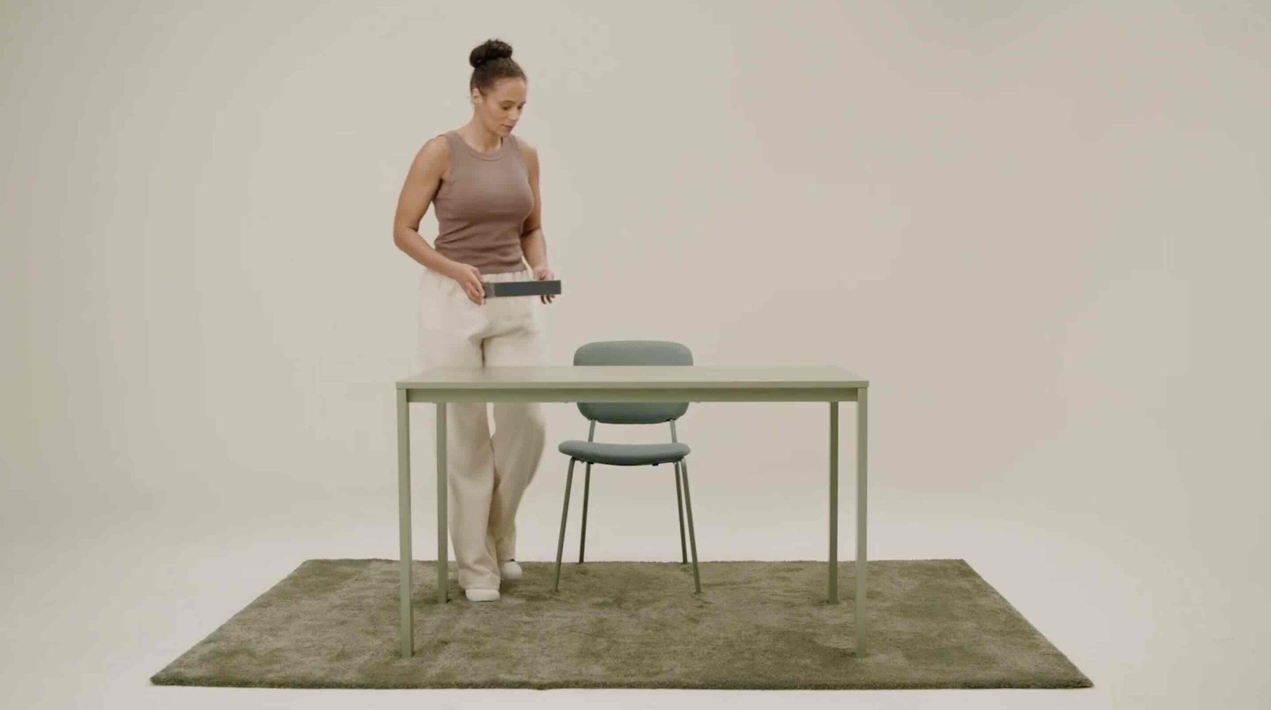 A woman walks onto set during the shooting of a Noom corporate video.