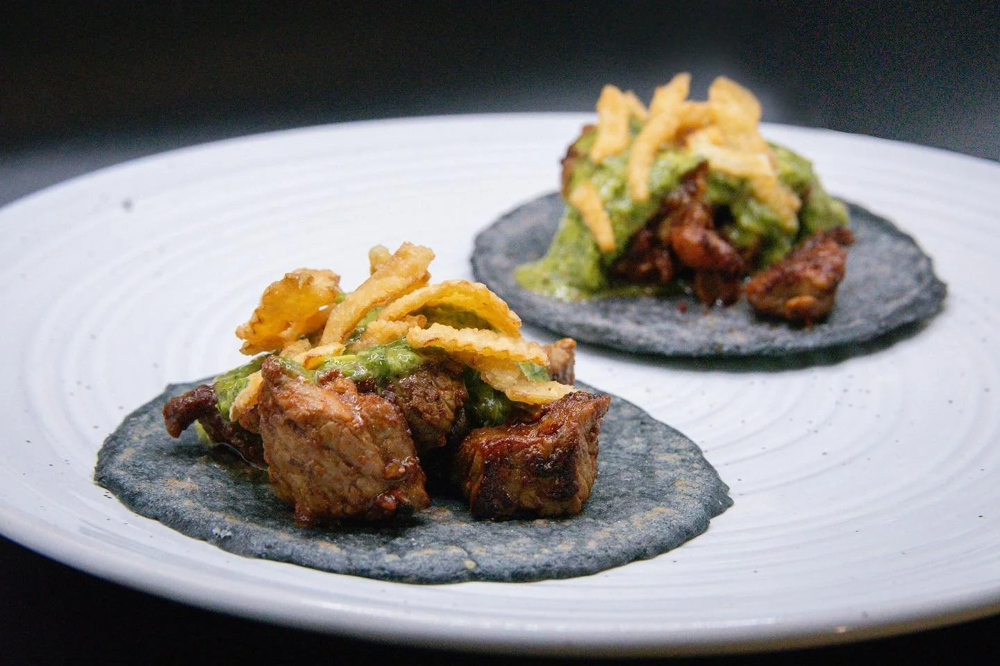Steak tacos 🤤 The first of many staples by @chefdillon. 
-
On our fresh heirloom indigo corn tortillas, Oaxacan marinated steak with chimi-churri and fried onions. 🌮 
-
-
#conarmorfl #conamor #tacos #masa #nixtamal #nixtamalization #freshcorn #ilik