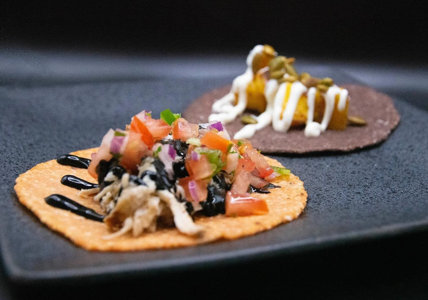 Halloween tacos 👻 🎃 
.
Orange and black masa tortillas made by @chefdillon for a Halloween party in Clearwater beach 🤤 
.
.

#orangetortilla #blacktortilla #blackmasa #redmasa #chickentaco #pumpkintaco #squidink #picodegallo #pepitas  #whitecorn #