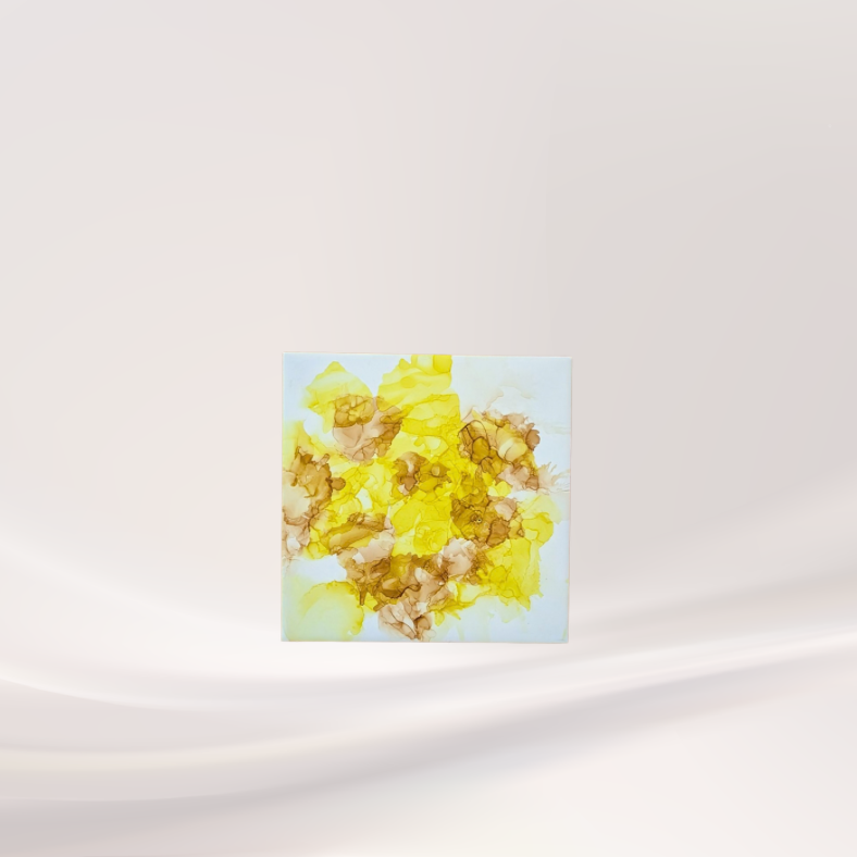 Yellow alcohol ink on ceramic tile