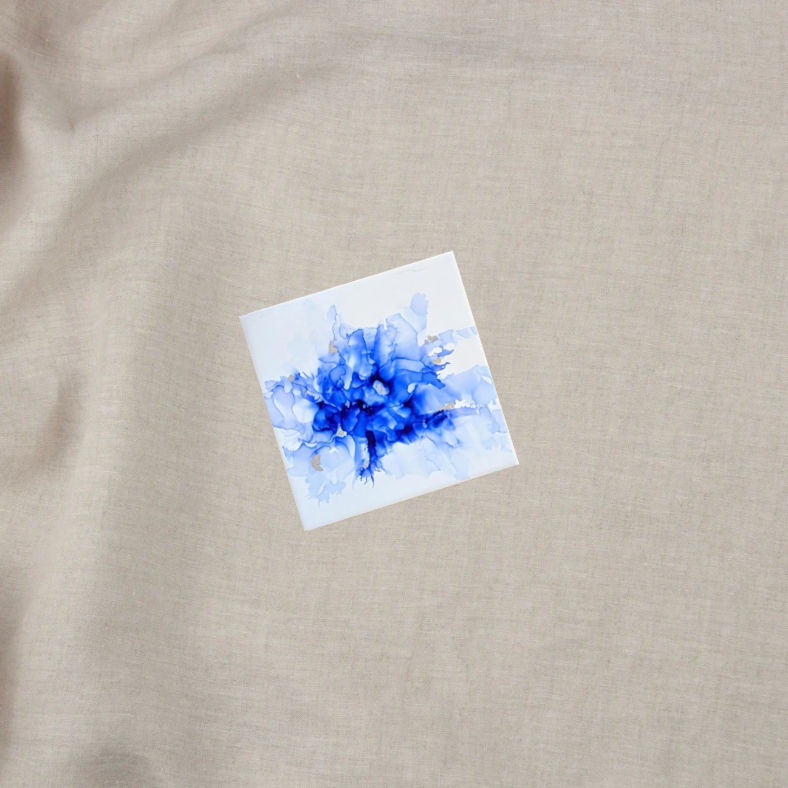 Blue alcohol ink on ceramic tile