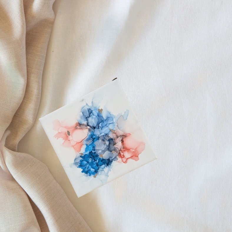 Blue and pink alcohol ink on ceramic tile