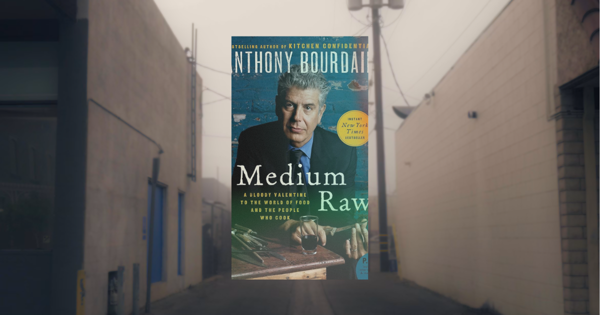 An image of the cover for Medium Raw against a burry photo of an alleyway