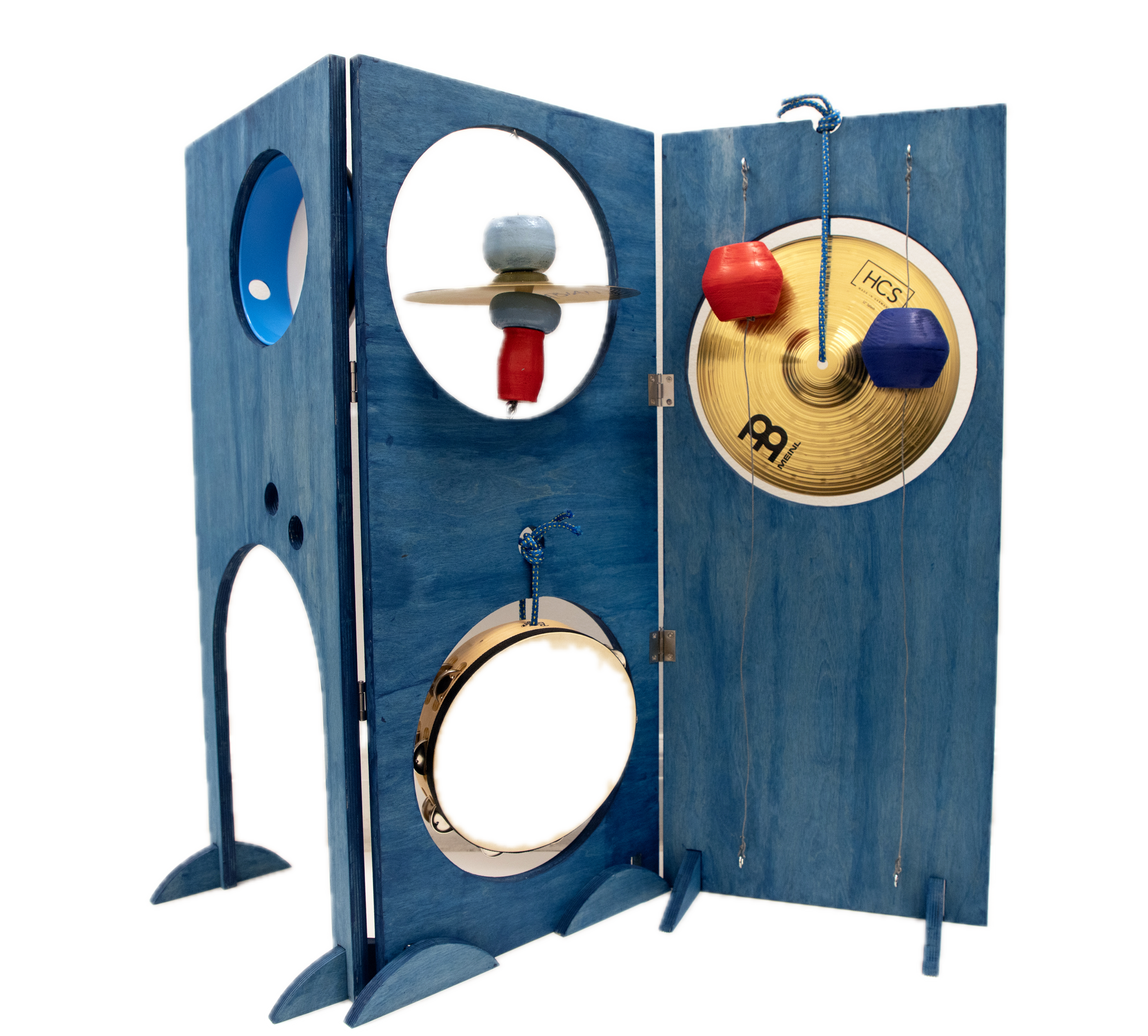 A wooden percussion instrument with various metal and wooden elements, including cymbals, trophies, and hanging objects, arranged in a blue frame.