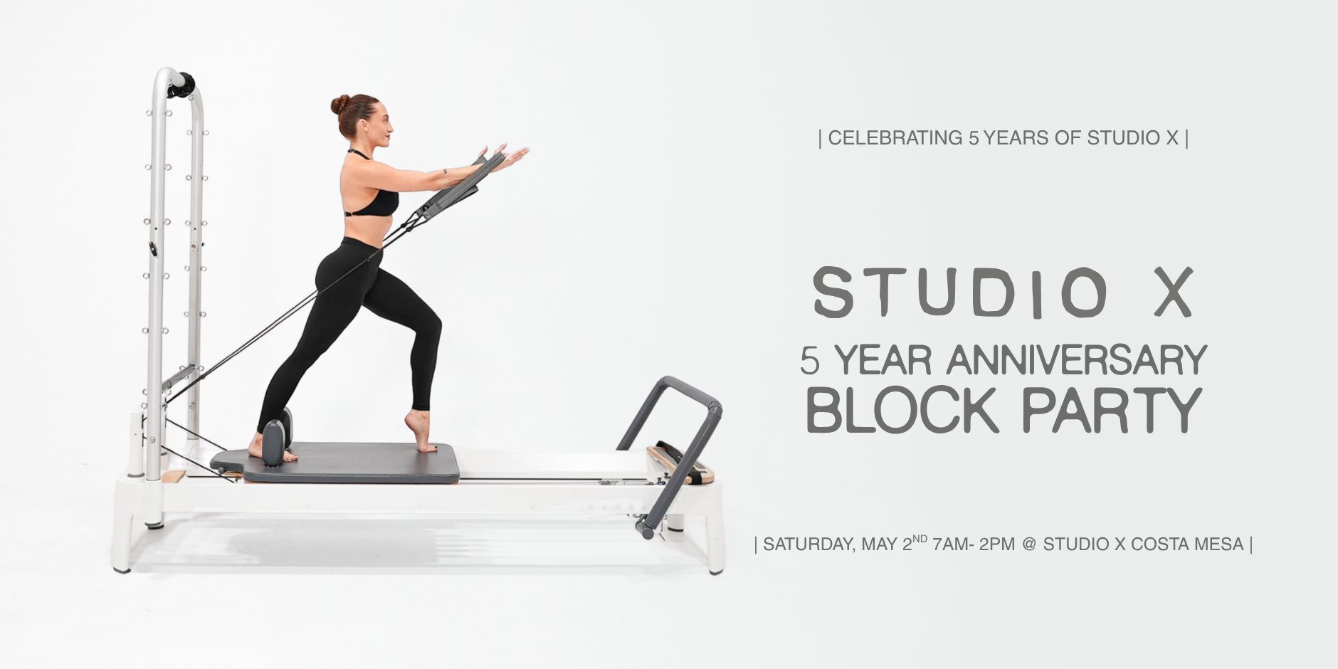 A woman in black workout clothes using a reformer Pilates machine in a minimal studio with white walls. Overlaid text announces the 5-year anniversary block party for Studio X, scheduled for Saturday, May 2, from 7 am to 2 pm at Studio X Costa Mesa.