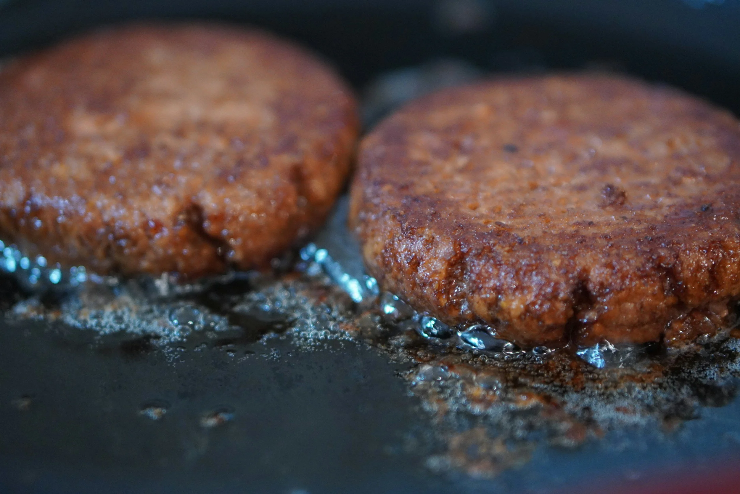 chicken patties on cast iron pan