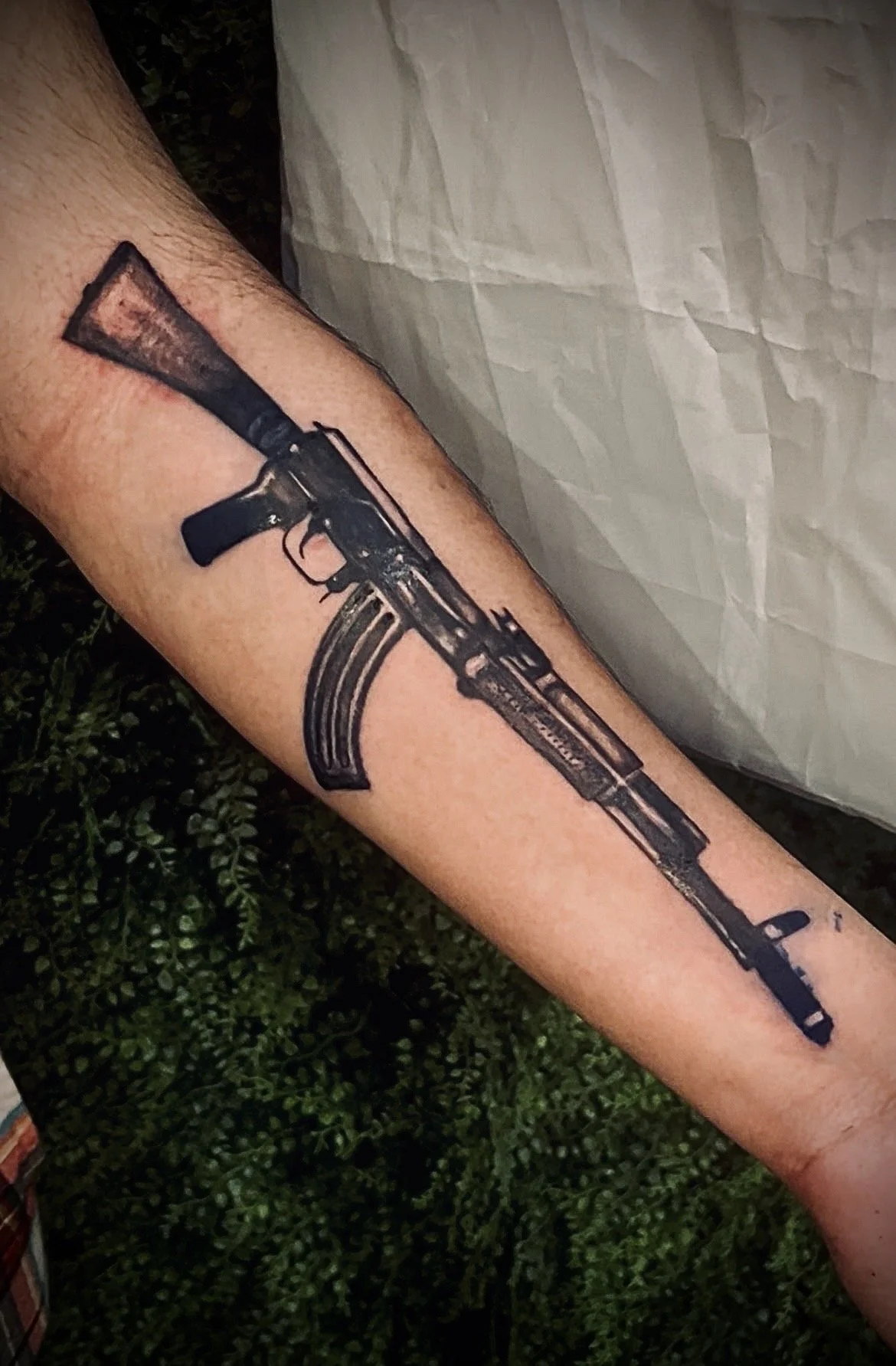 AK-47 on forearm