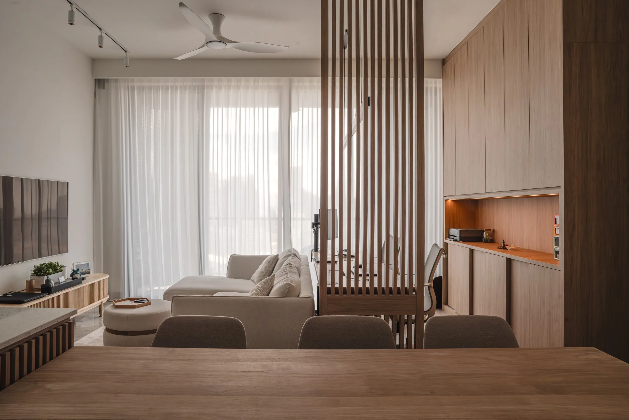 Condo renovation in Singapore with neutral tones and built-in storage.