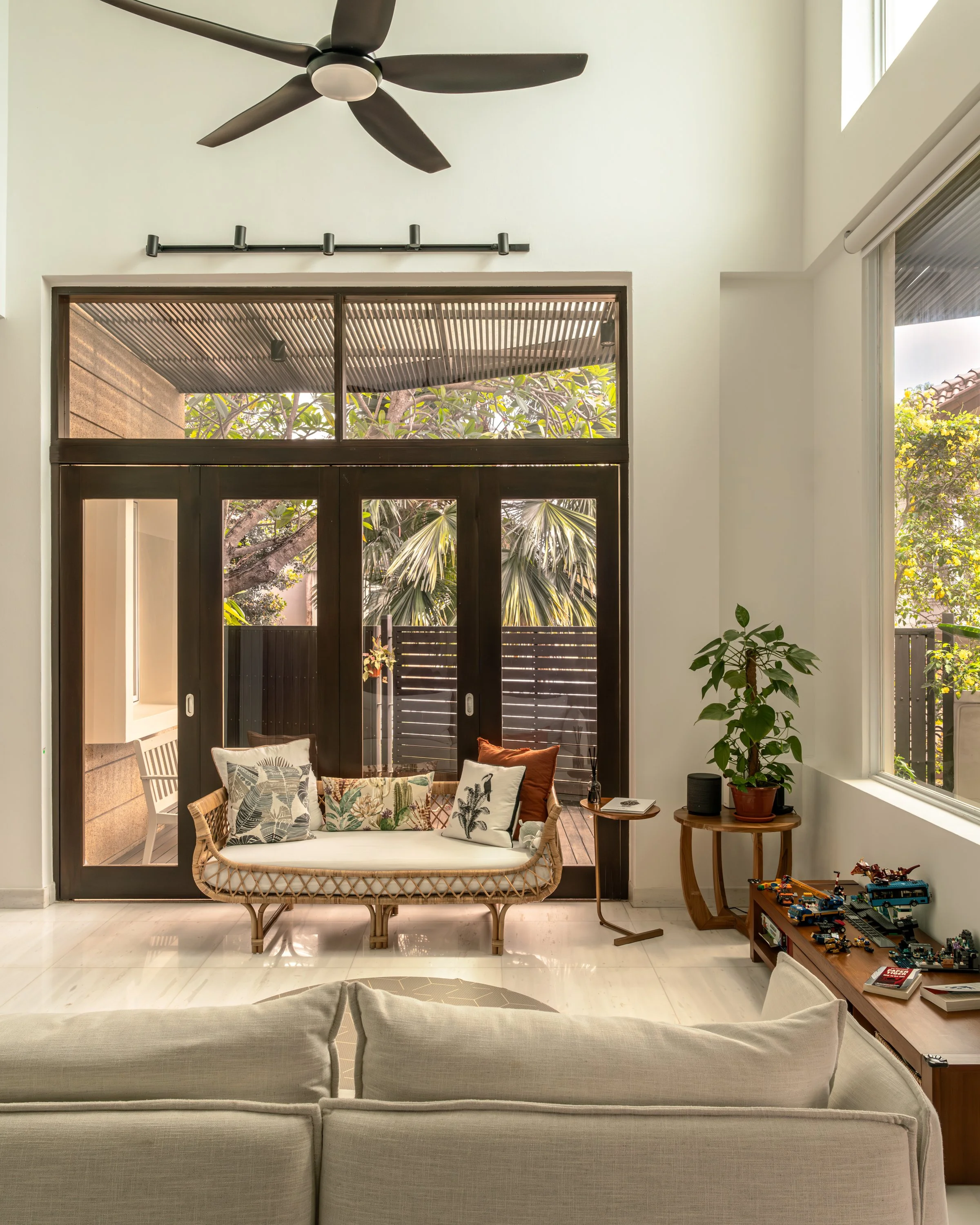 Modern Tropical living room design for a Singapore Landed Home by Couple Abode Interior Design.
