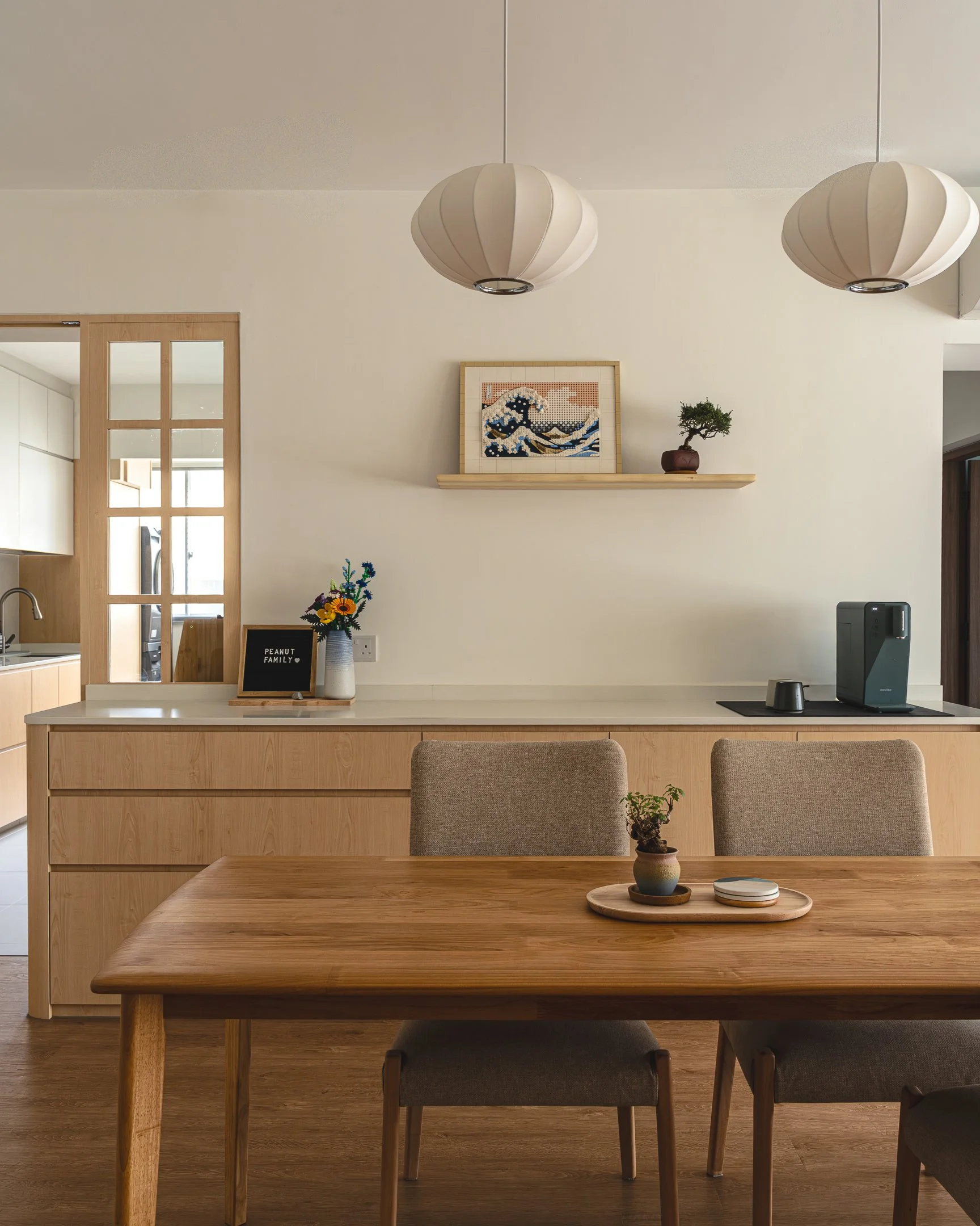 japandi 4 room bto interior design by couple abode showing dining area with dinging light Japanese inspired