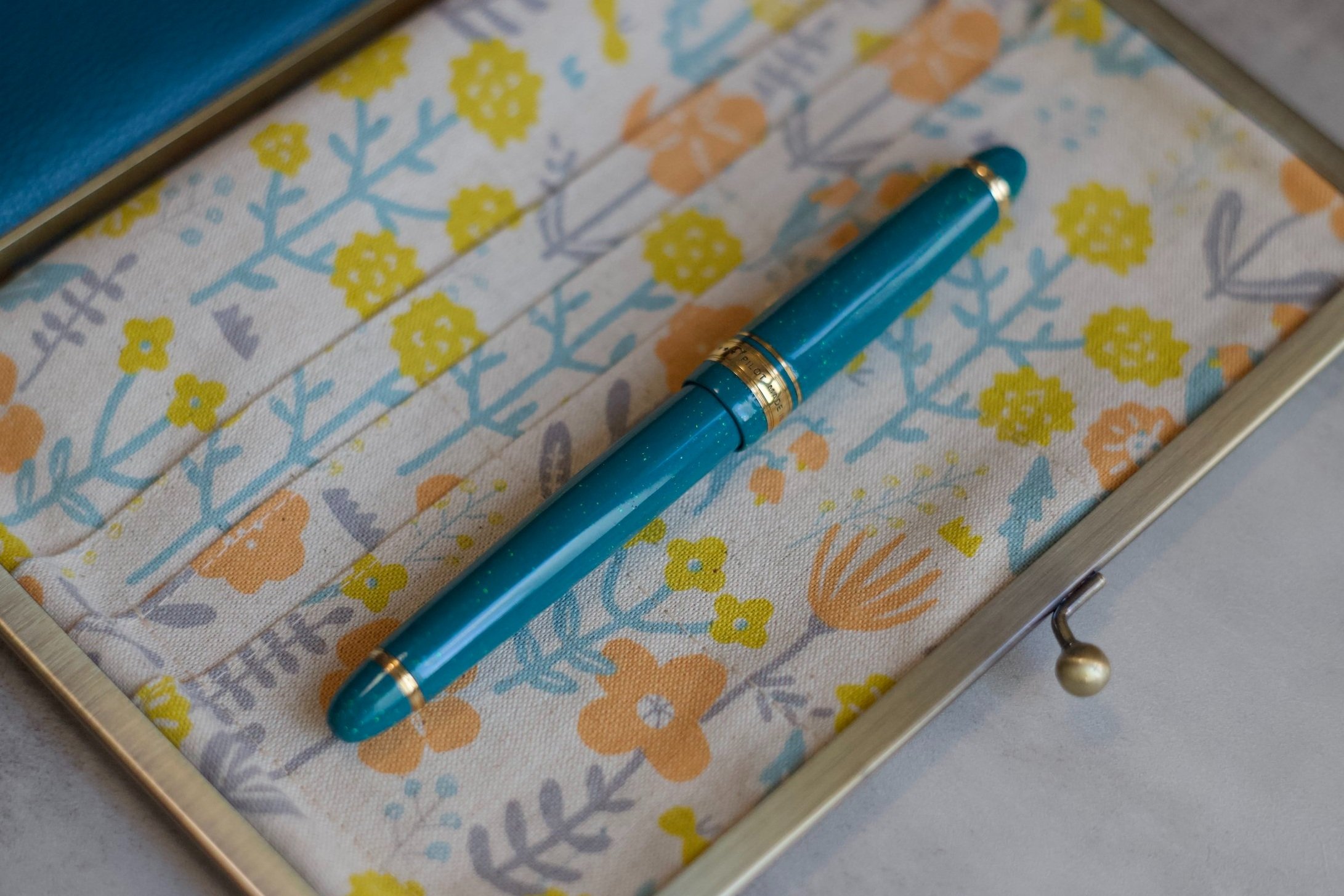 Opal on teal urushi fountain pen