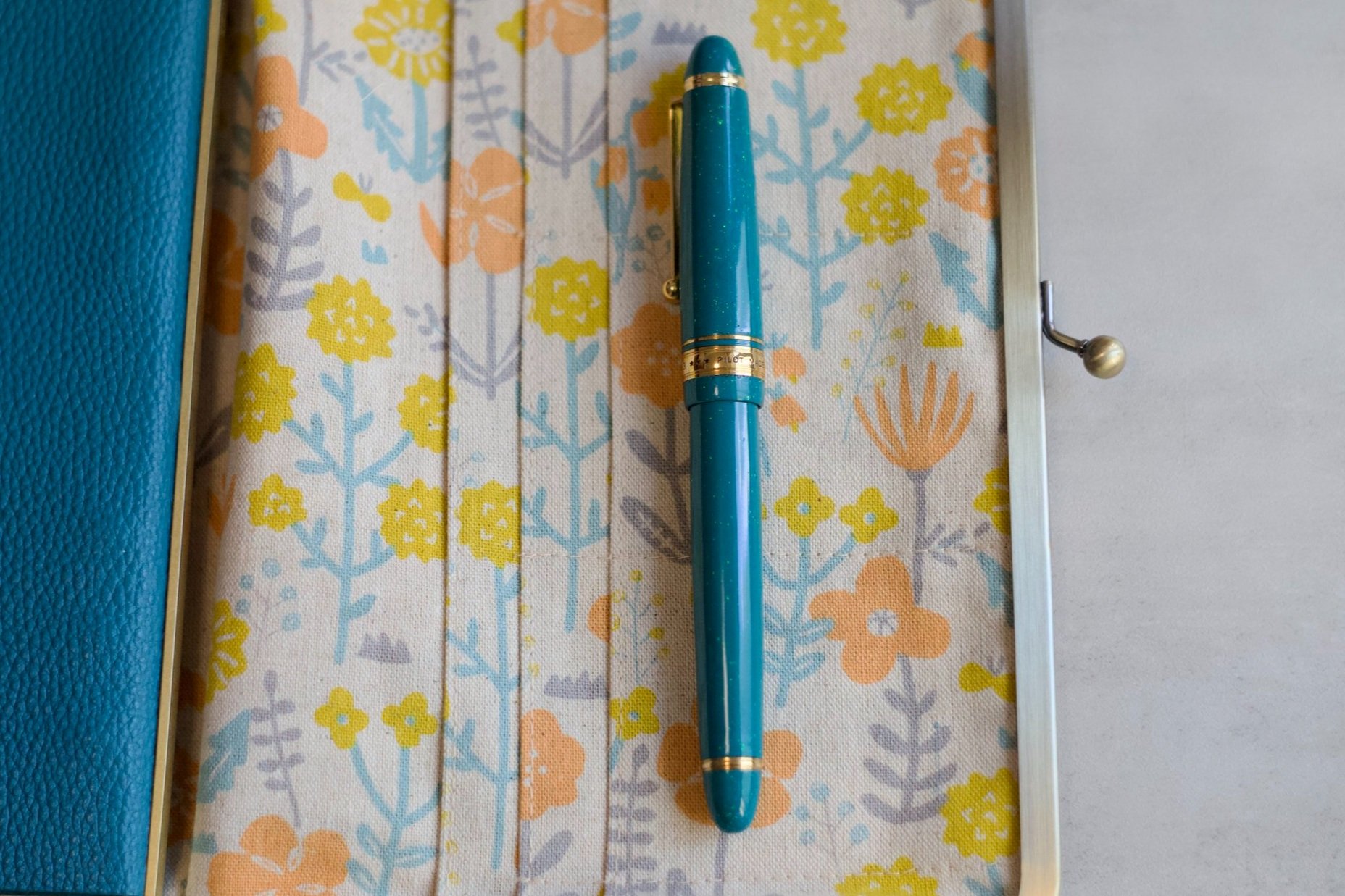 Opal on teal urushi fountain pen