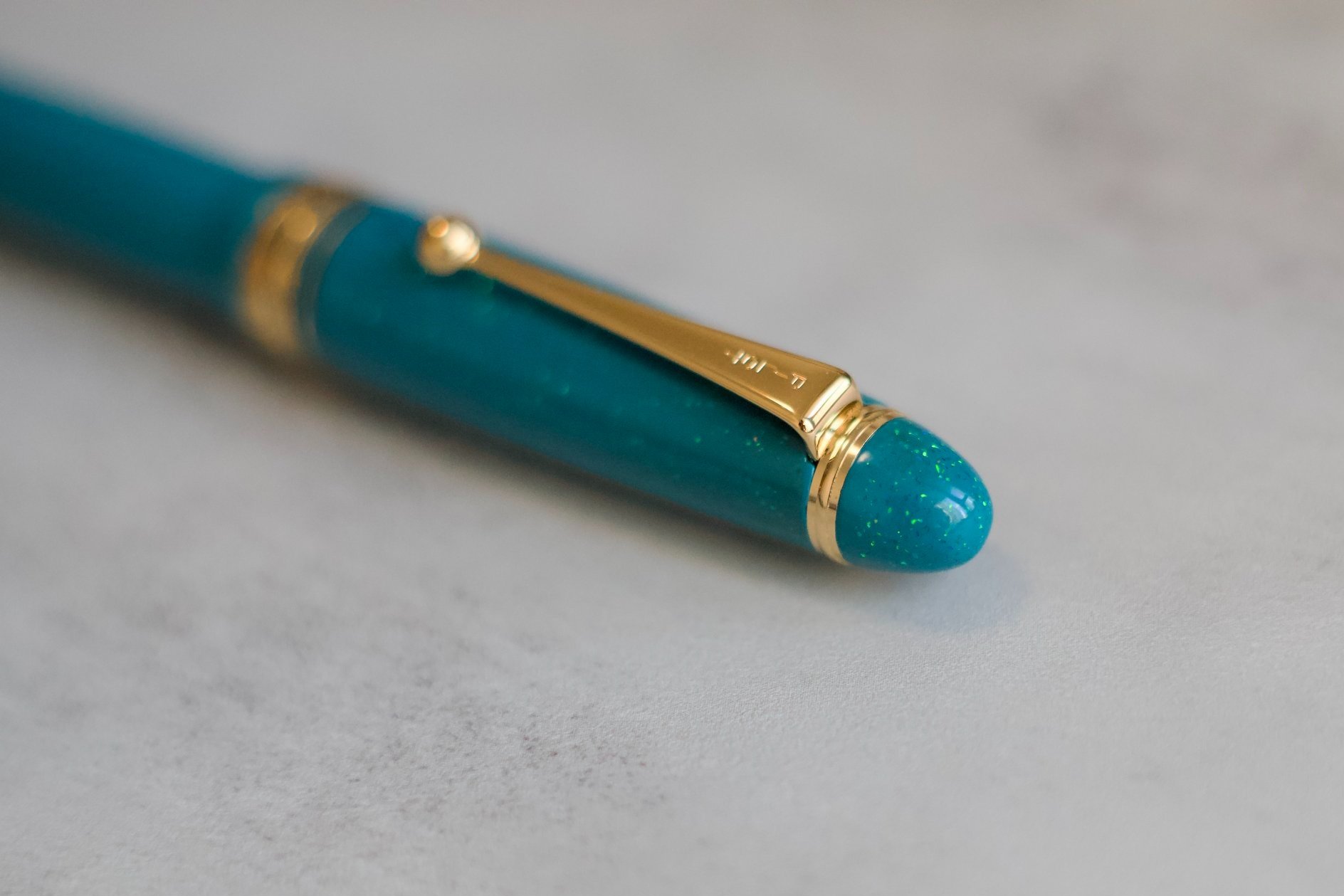 Opal on teal urushi fountain pen