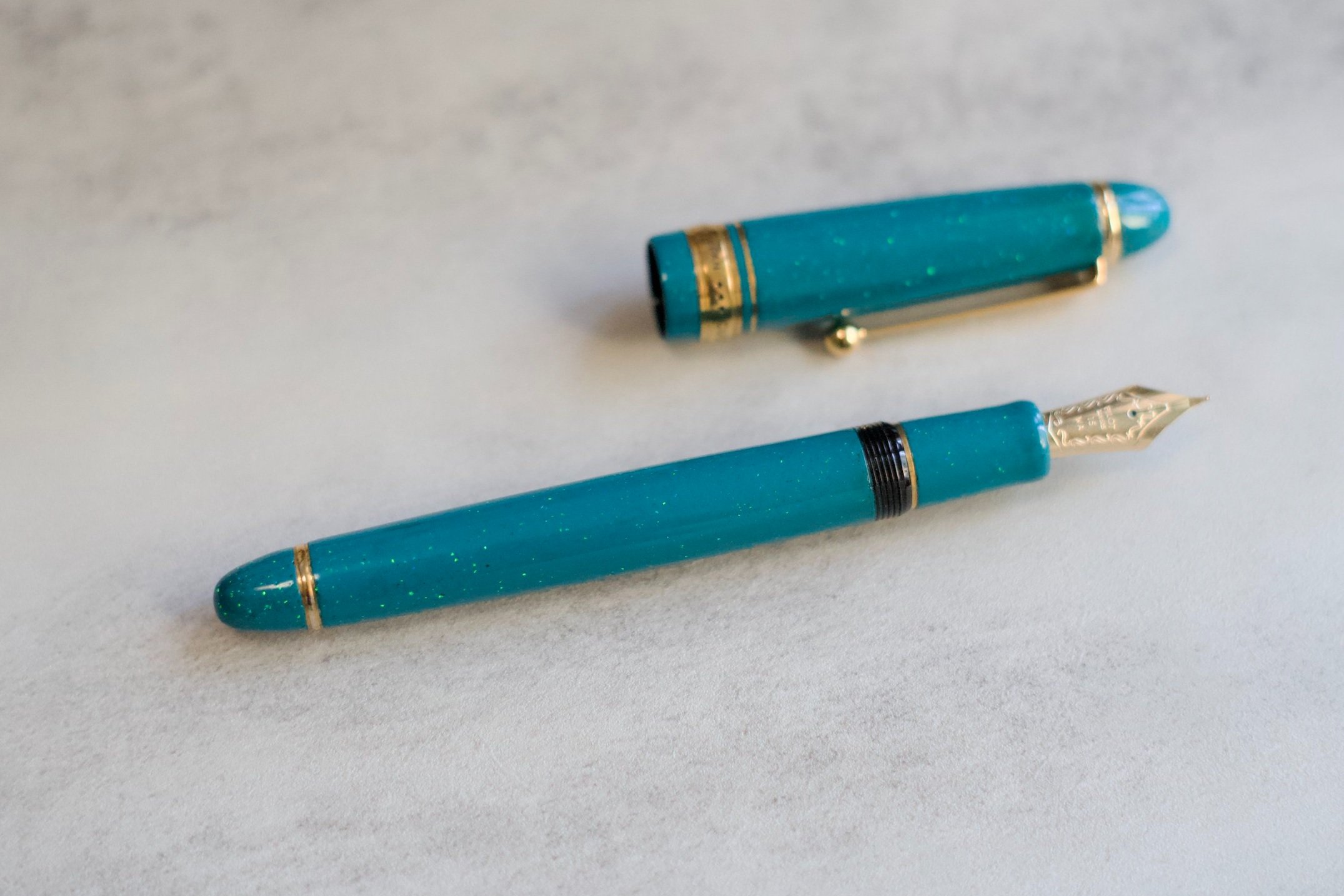 Opal on teal urushi fountain pen