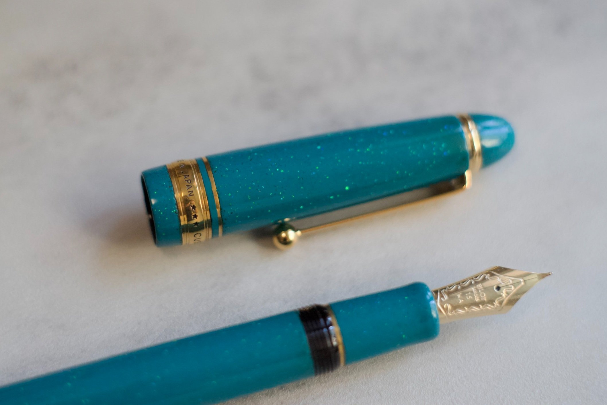 Opal on teal urushi fountain pen