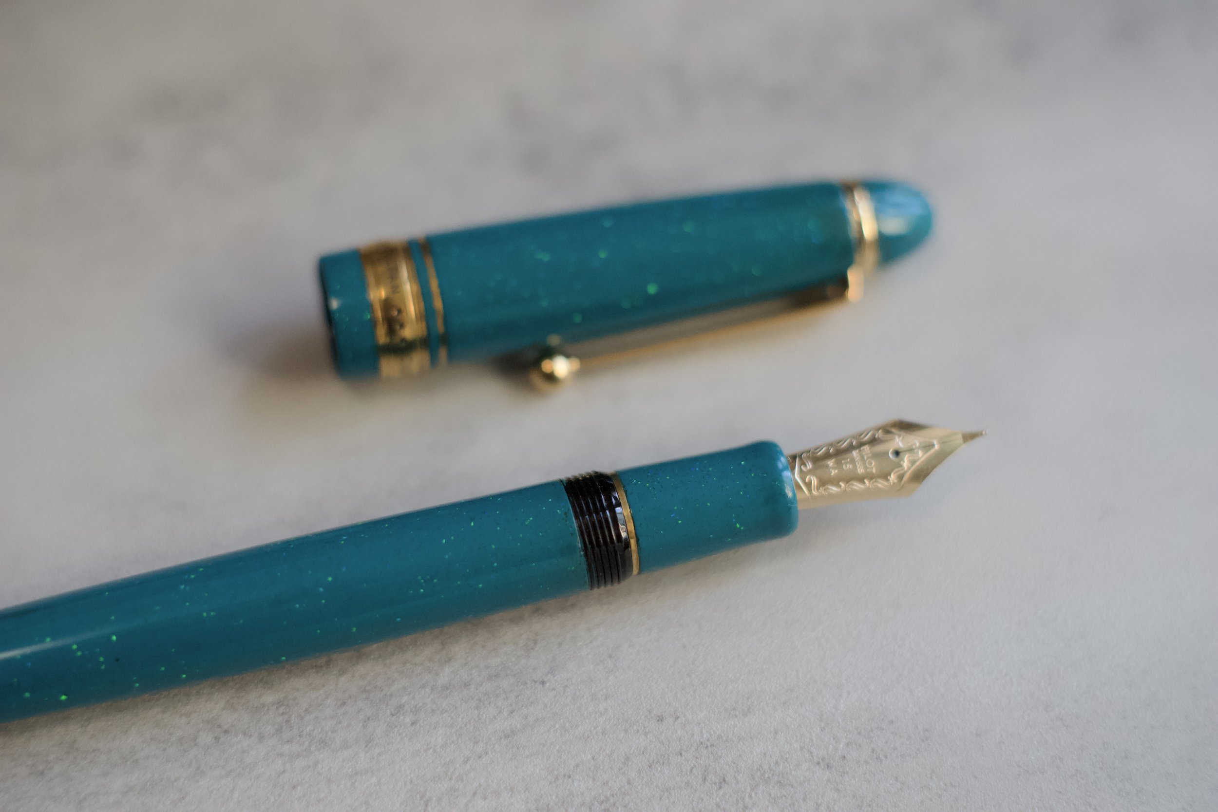 Opal on teal urushi fountain pen