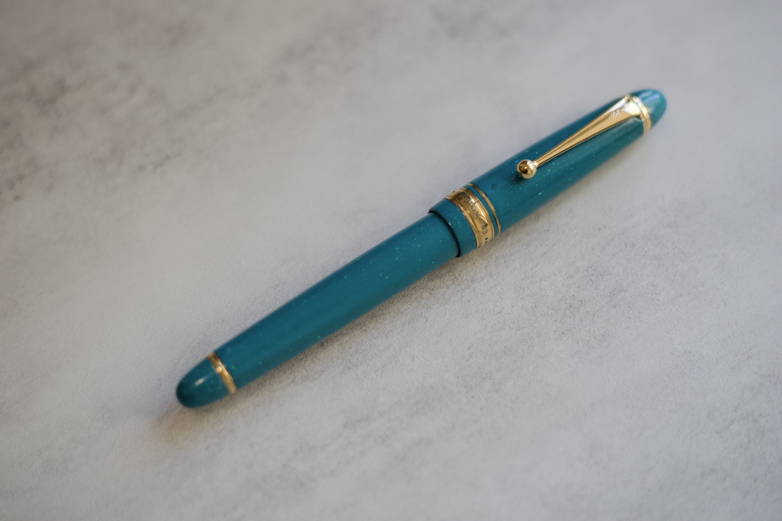 Opal on teal urushi fountain pen