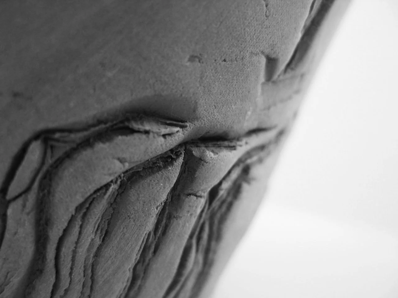 Close up of experimental textures in clay pot.