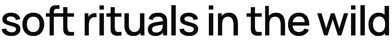 Text overlay on a blurred background that reads 'soft rituals in the wild' in large, black font.