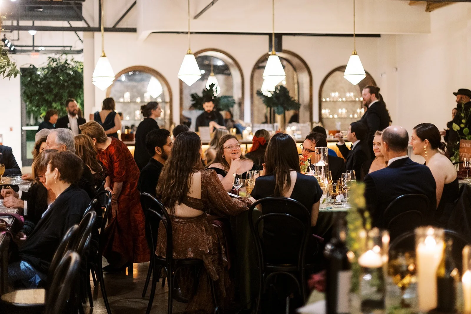 Guests enjoy a candlelit dinner beside the bar in the Bow Truss