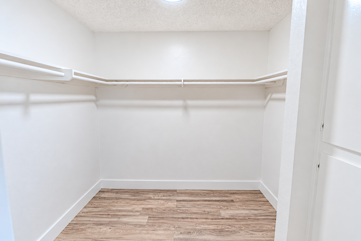 Bright Minimalist Walk-In Closet.png