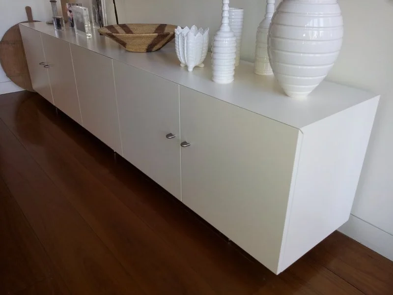 floating white cabinetry.jpeg