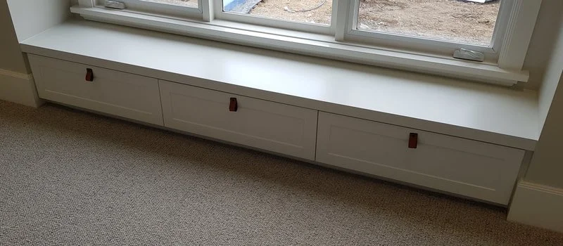 under window cabinetry cabinet smith.jpeg