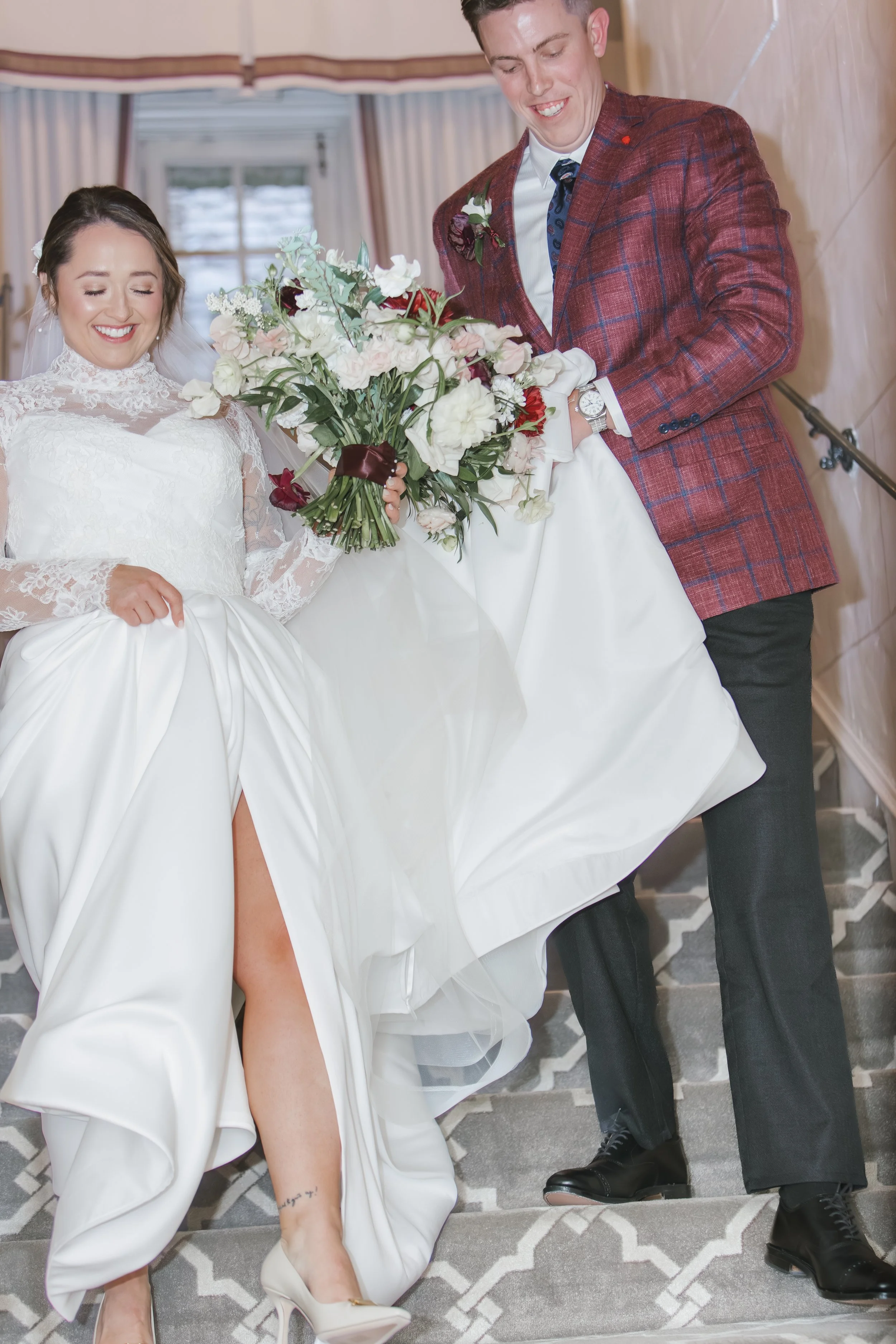 Bride and groom walking down the steps at Longview country club in Pittsburgh pa