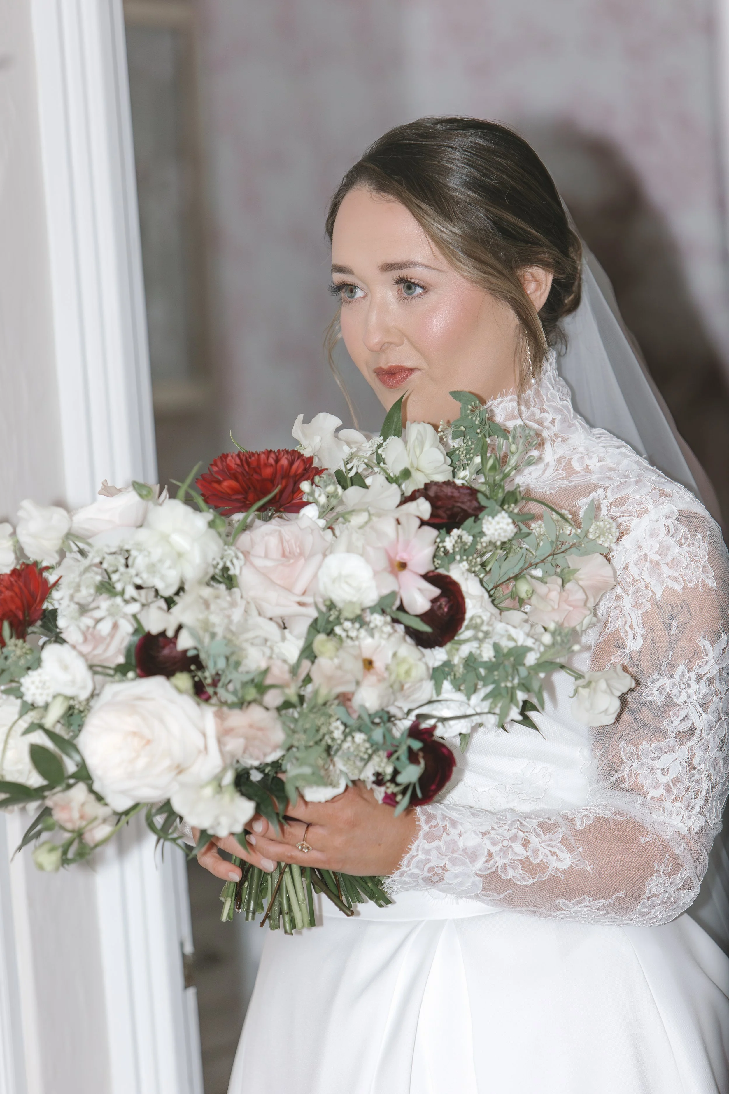 Bride holding onto a bouquet of flowers at Longview country club in Pittsburgh pa