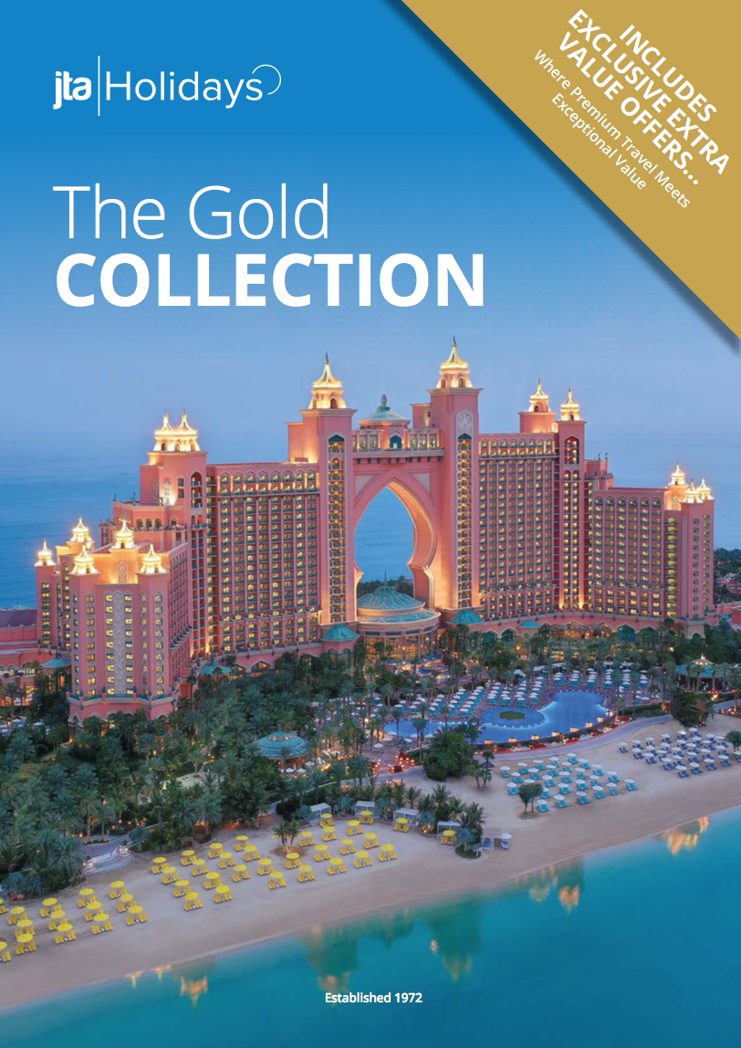 Cover of a travel brochure showing the Atlantis Paradise Island resort in the Bahamas with the ocean in the background. The resort is large, pink, and illuminated at dusk, with a beach, lounge chairs, and palm trees in the foreground.