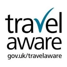 Travel Aware logo with text and a checkmark in the shape of a V, promoting travel safety on a GOV UK website.
