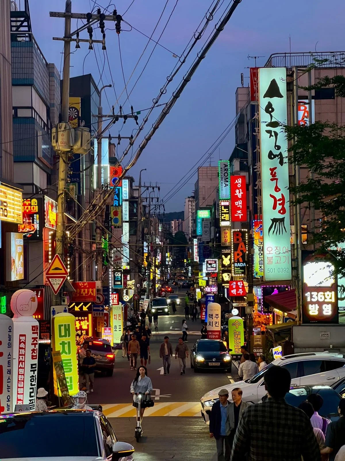 Exploring the district of Hongdae by night, with fun young hip cafes, shopping entertainment and more in Seoul, South Korea